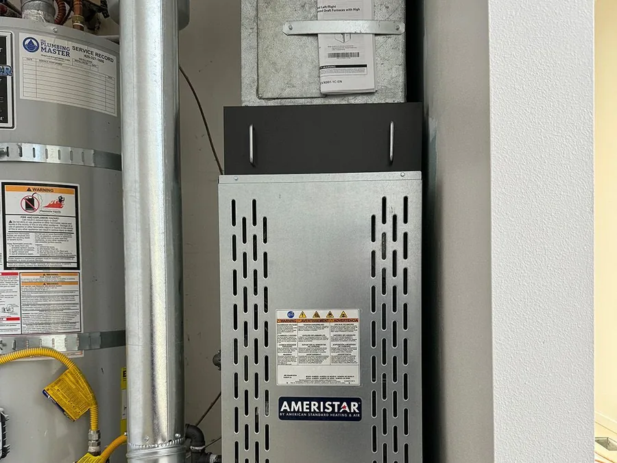 Replacement gas furnace and water heater installed in a Seattle area home.