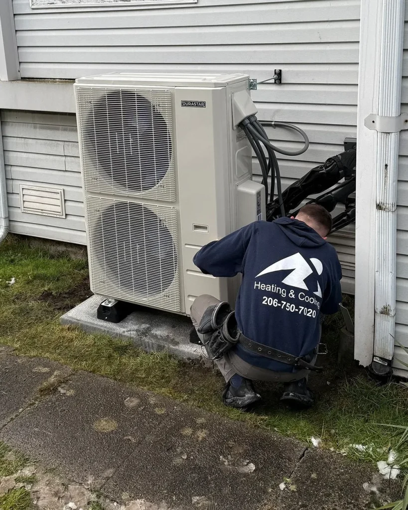 Ready Energy Solutions technician servicing a heat pump at a home near Seattle, Washington.