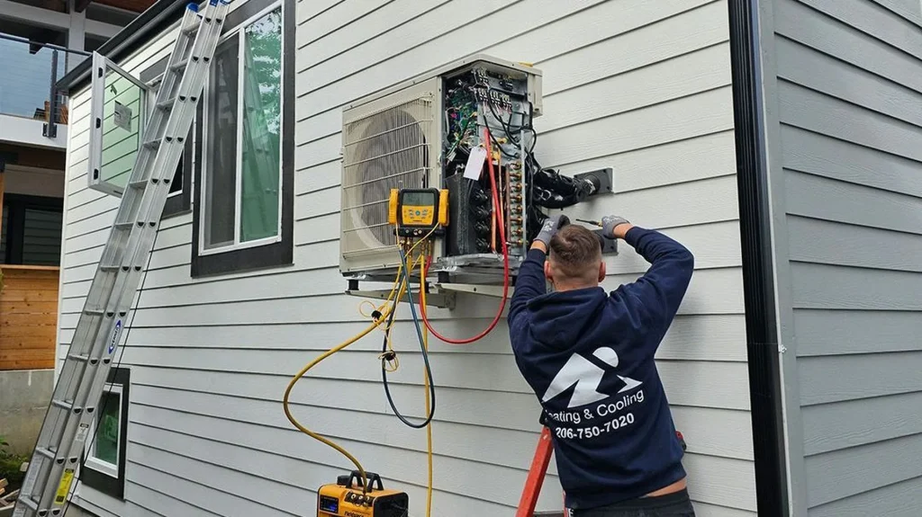Ready Energy Solutions technician installing a ductless heat pump at a home near Seattle, Washington.