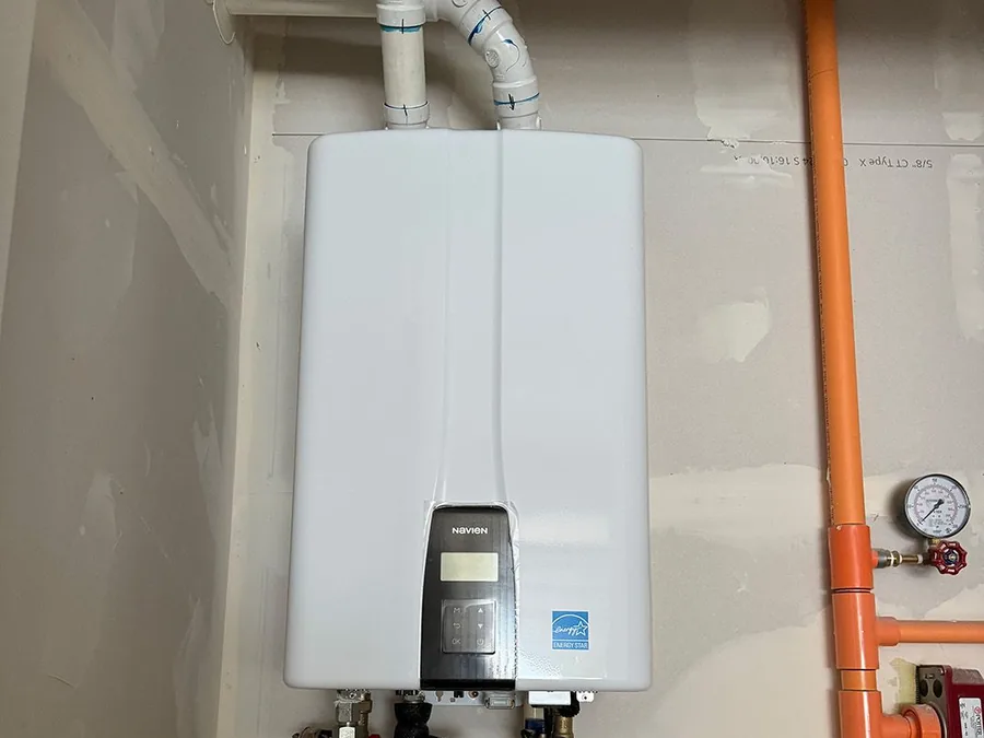Tankless water heater installed on a wall in a Seattle area home.