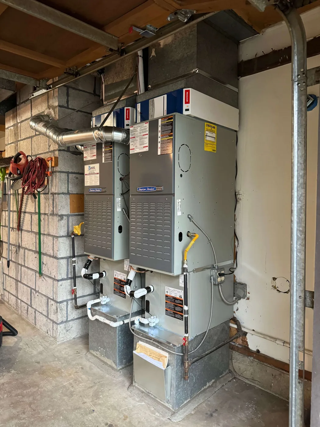 Two American Standard air handlers installed side by side in a Seattle area garage.
