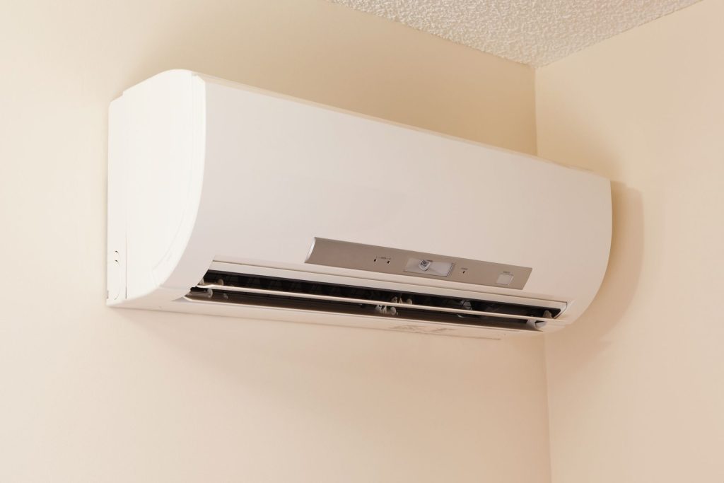 Ductless mini-split indoor unit installed in Seattle home compared to gas furnace system.